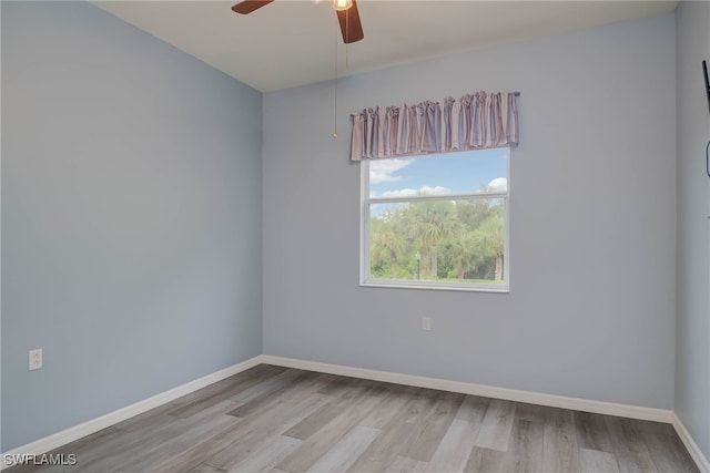 8320 Whiskey Preserve Cir Unit 321, Fort Myers, FL 33919 - empty room with wood finished floors, baseboards, and a ceiling fan