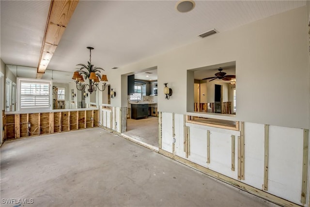 2685 Geary St, Matlacha, FL 33993 - interior space featuring concrete floors, ceiling fan, and a chandelier