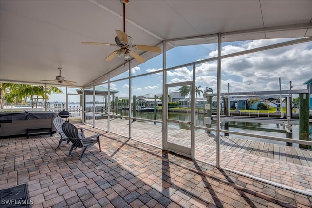 2685 Geary St, Matlacha, FL 33993 - sunroom with a water view, ceiling fan, a hot tub, vaulted ceiling, and plenty of natural light