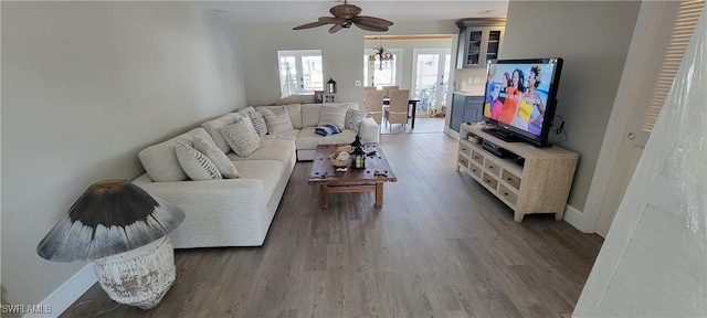 2685 Geary St, Matlacha, FL 33993 - living area with a ceiling fan, wood finished floors, and baseboards