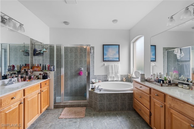 7384 Sika Deer Way, Fort Myers, FL 33966 - full bath featuring vanity, a bath, a stall shower, and tile patterned flooring