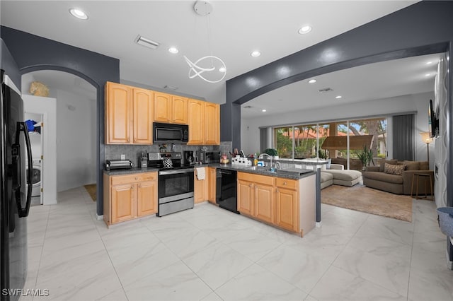 7384 Sika Deer Way, Fort Myers, FL 33966 - kitchen with black appliances, arched walkways, open floor plan, a peninsula, and backsplash