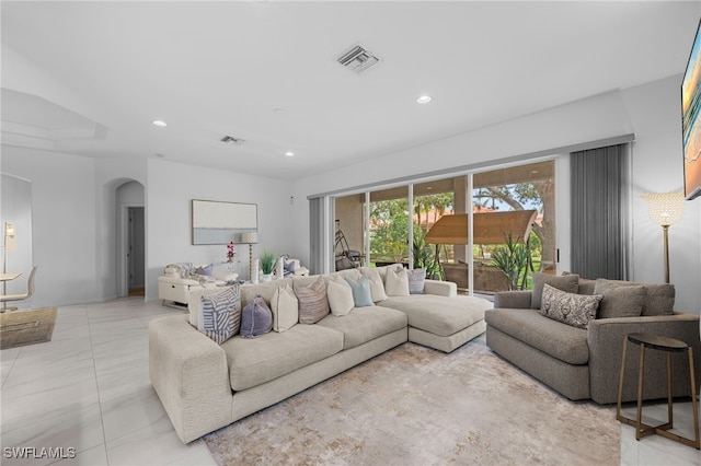 7384 Sika Deer Way, Fort Myers, FL 33966 - living room featuring arched walkways, marble finish flooring, and recessed lighting