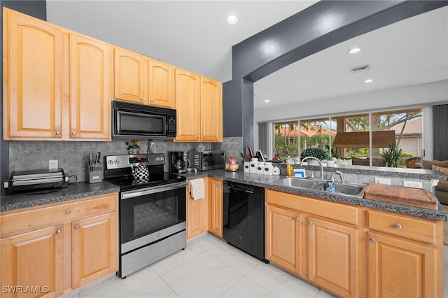 7384 Sika Deer Way, Fort Myers, FL 33966 - kitchen featuring black appliances, a sink, light brown cabinets, dark countertops, and decorative backsplash