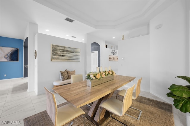 7384 Sika Deer Way, Fort Myers, FL 33966 - dining room with arched walkways, recessed lighting, and a tray ceiling