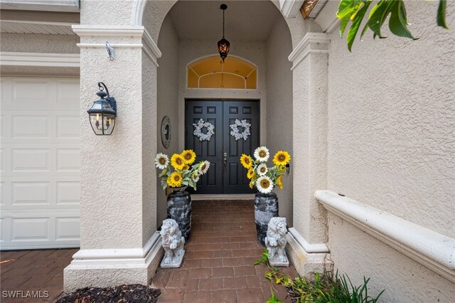 7384 Sika Deer Way, Fort Myers, FL 33966 - entrance to property featuring stucco siding and a garage