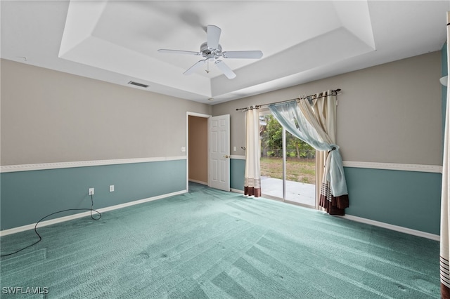 206 SE 12th Ter, Cape Coral, FL 33990 - carpeted spare room featuring a raised ceiling, baseboards, and ceiling fan