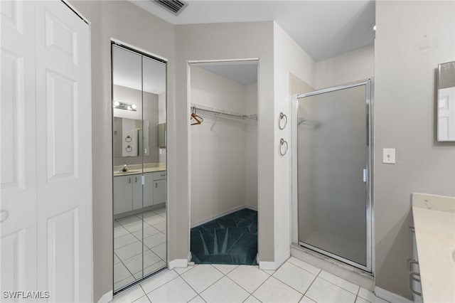 206 SE 12th Ter, Cape Coral, FL 33990 - full bath with vanity, a shower stall, tile patterned floors, and a spacious closet