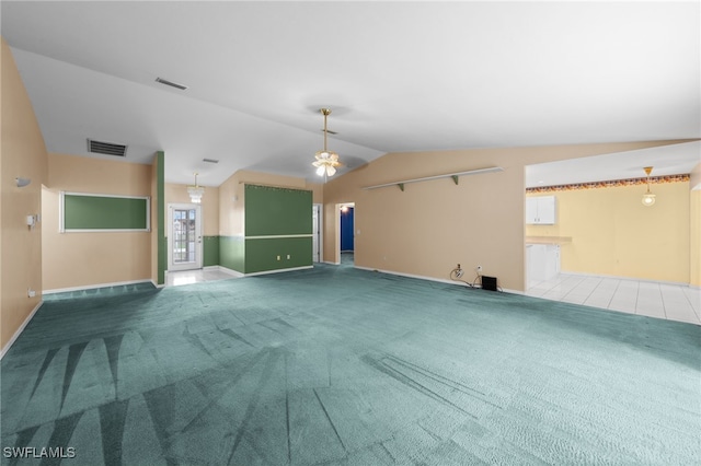 206 SE 12th Ter, Cape Coral, FL 33990 - unfurnished living room with carpet floors, lofted ceiling, baseboards, and ceiling fan