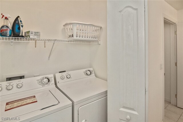 10350 Washingtonia Palm Way Unit 4234, Fort Myers, FL 33966 - washroom with independent washer and dryer and light tile patterned floors