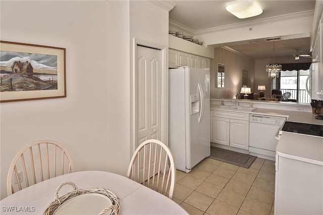 10350 Washingtonia Palm Way Unit 4234, Fort Myers, FL 33966 - kitchen with white appliances, crown molding, light tile patterned floors, light countertops, and a sink
