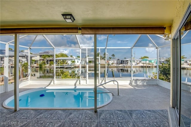 2692 Clyde St, Matlacha, FL 33993 - swimming pool with a water view, glass enclosure, a patio area, and a boat dock