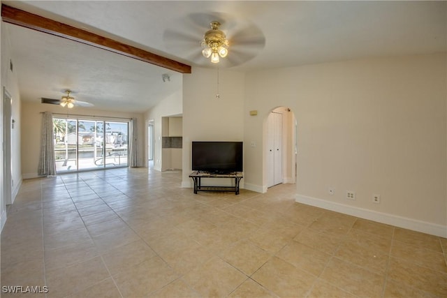 2692 Clyde St, Matlacha, FL 33993 - unfurnished living room featuring ceiling fan, baseboards, and light tile patterned flooring