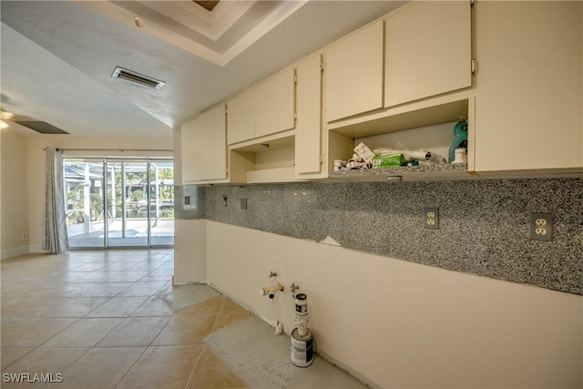 2692 Clyde St, Matlacha, FL 33993 - kitchen featuring light tile patterned flooring, tasteful backsplash, open shelves, a ceiling fan, and crown molding