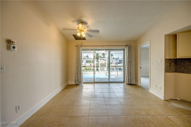 2692 Clyde St, Matlacha, FL 33993 - spare room featuring a ceiling fan, light tile patterned floors, and baseboards