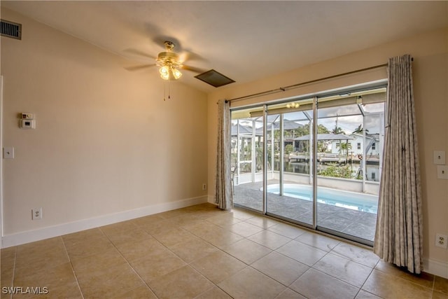 2692 Clyde St, Matlacha, FL 33993 - spare room featuring a ceiling fan, baseboards, and light tile patterned floors