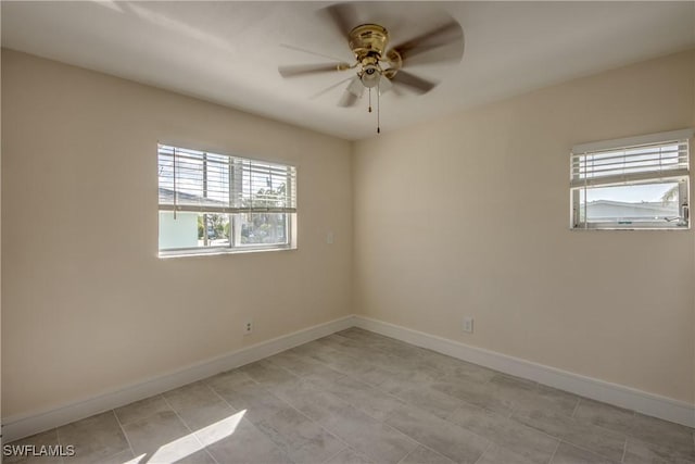 2692 Clyde St, Matlacha, FL 33993 - empty room featuring a ceiling fan, baseboards, and light tile patterned flooring