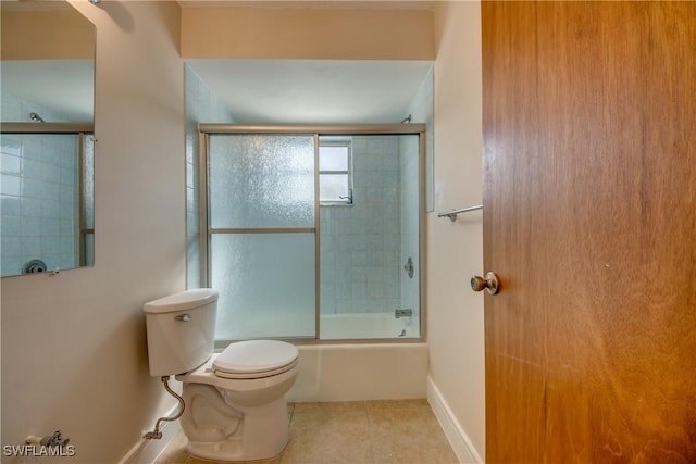 2692 Clyde St, Matlacha, FL 33993 - full bath featuring tile patterned floors, toilet, combined bath / shower with glass door, and baseboards