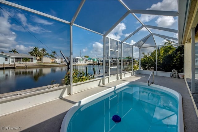 2692 Clyde St, Matlacha, FL 33993 - swimming pool featuring a water view, a patio, and glass enclosure