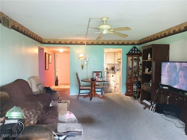 198 Joel Blvd Unit 3, Lehigh Acres, FL 33936 - living room featuring a ceiling fan and carpet