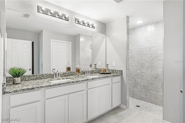2521 NW 15th Ave, Cape Coral, FL 33993 - full bath featuring double vanity, walk in shower, and baseboards