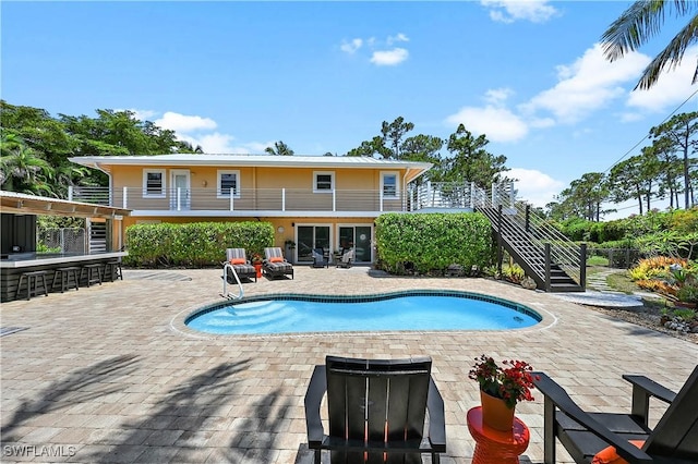 4680 Key Largo Ln, Bonita Springs, FL 34134 - swimming pool featuring stairway and a patio