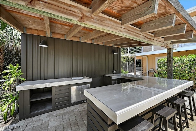 4680 Key Largo Ln, Bonita Springs, FL 34134 - view of patio / terrace featuring exterior kitchen
