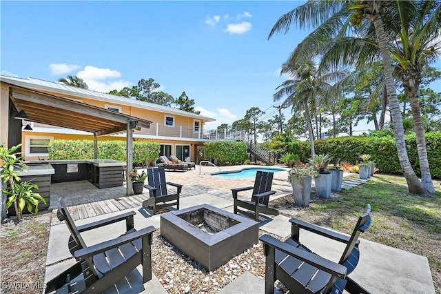 4680 Key Largo Ln, Bonita Springs, FL 34134 - view of patio featuring an outdoor fire pit, an outdoor pool, and a balcony