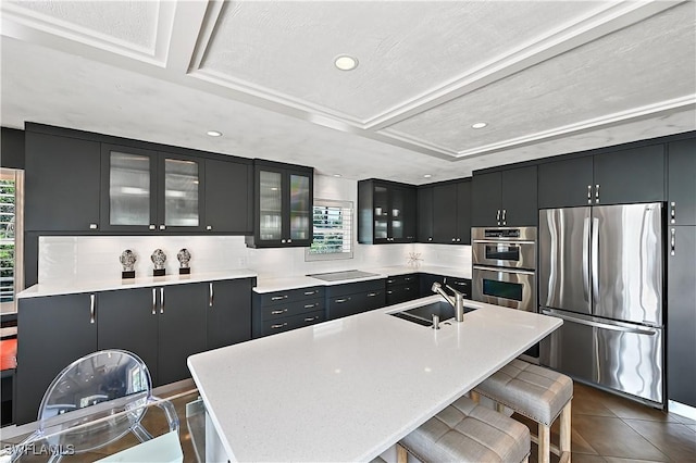 4680 Key Largo Ln, Bonita Springs, FL 34134 - kitchen featuring appliances with stainless steel finishes, a sink, plenty of natural light, dark cabinetry, and recessed lighting