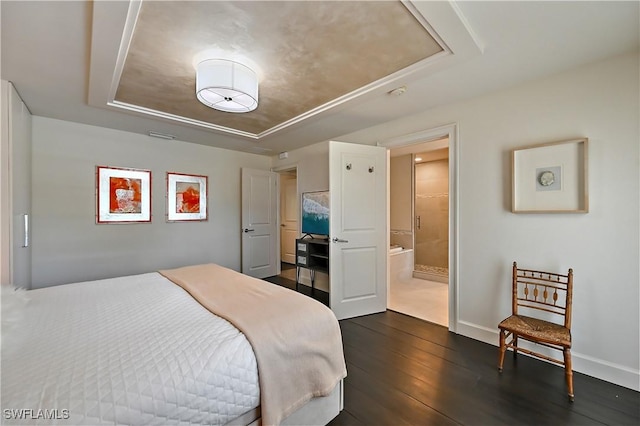 4680 Key Largo Ln, Bonita Springs, FL 34134 - bedroom featuring a tray ceiling, dark wood-style floors, baseboards, and ensuite bathroom