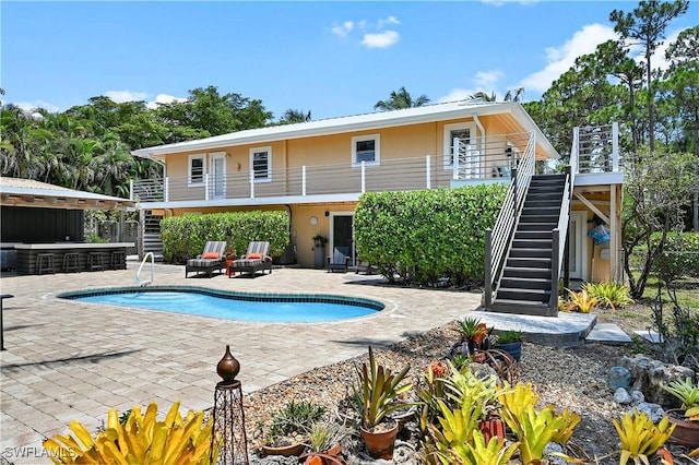 4680 Key Largo Ln, Bonita Springs, FL 34134 - outdoor pool featuring stairway and a patio