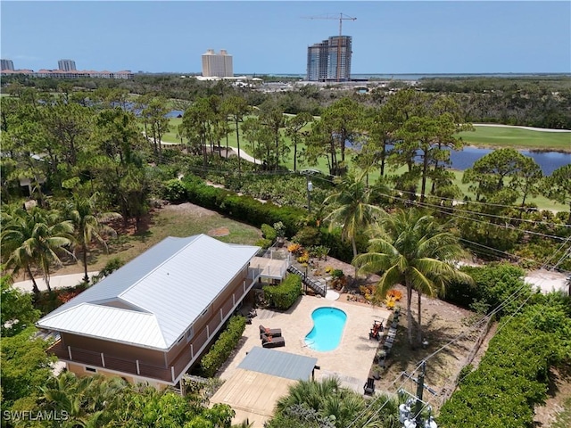 4680 Key Largo Ln, Bonita Springs, FL 34134 - bird's eye view of a pool area, a large body of water, and a tree filled landscape