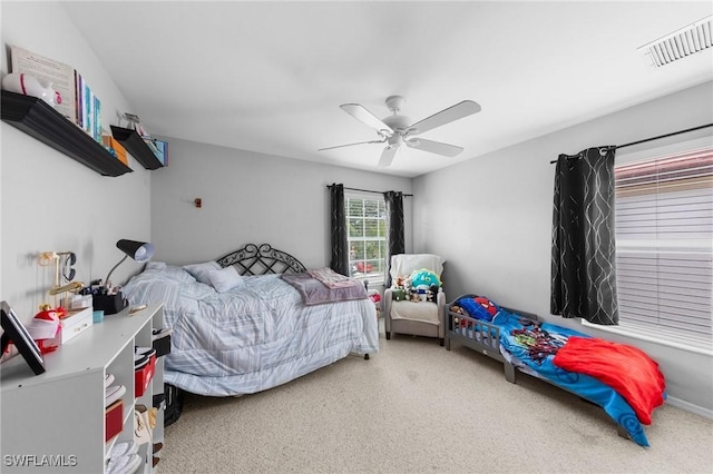 8364 Laurel Lakes Blvd, Naples, FL 34119 - carpeted bedroom featuring a ceiling fan