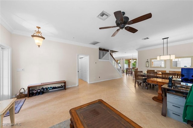 8364 Laurel Lakes Blvd, Naples, FL 34119 - living area featuring ceiling fan, crown molding, light tile patterned floors, and stairs
