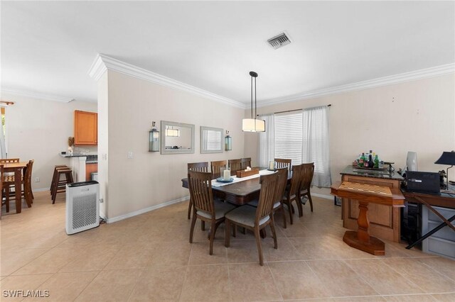 8364 Laurel Lakes Blvd, Naples, FL 34119 - dining area with crown molding and light tile patterned floors