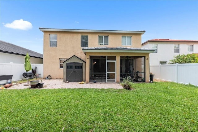 8364 Laurel Lakes Blvd, Naples, FL 34119 - back of property featuring stucco siding, ceiling fan, a fenced backyard, and a sunroom