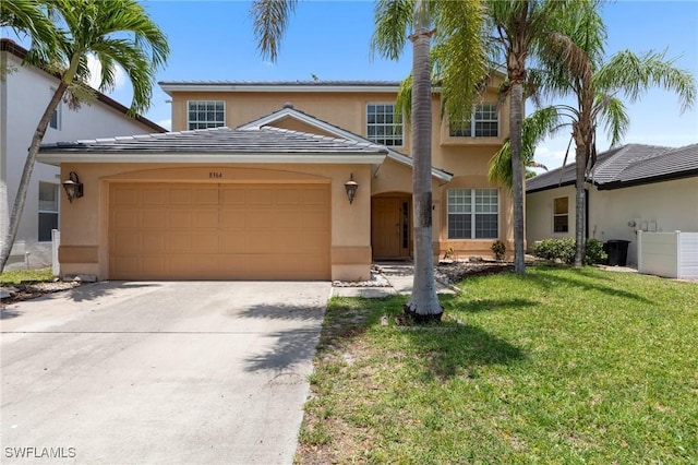 8364 Laurel Lakes Blvd, Naples, FL 34119 - traditional home featuring stucco siding, an attached garage, and concrete driveway