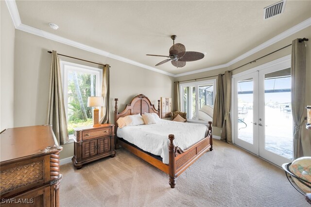 4009 Chiquita Blvd S, Cape Coral, FL 33914 - bedroom featuring french doors, access to exterior, crown molding, light colored carpet, and multiple windows