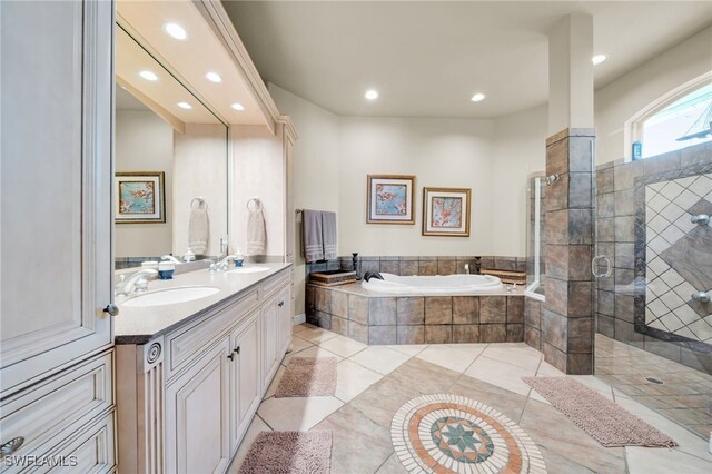 4009 Chiquita Blvd S, Cape Coral, FL 33914 - full bathroom featuring a garden tub, double vanity, tiled shower, recessed lighting, and tile patterned flooring