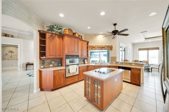 4009 Chiquita Blvd S, Cape Coral, FL 33914 - kitchen with open shelves, appliances with stainless steel finishes, light countertops, a peninsula, and recessed lighting