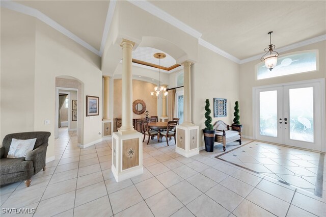 4009 Chiquita Blvd S, Cape Coral, FL 33914 - foyer featuring ornate columns, a towering ceiling, light tile patterned floors, french doors, and arched walkways