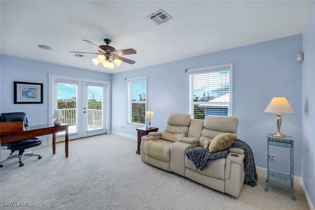 654 Sea Oats Dr, Sanibel, FL 33957 - carpeted living area featuring french doors, an office area, healthy amount of natural light, and baseboards