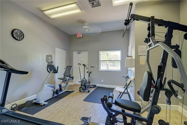 14931 Park Lake Dr Unit 209, Fort Myers, FL 33919 - workout room with wood finished floors and baseboards