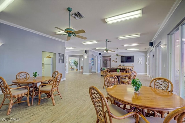 14931 Park Lake Dr Unit 209, Fort Myers, FL 33919 - dining room with a ceiling fan, crown molding, light wood finished floors, and baseboards