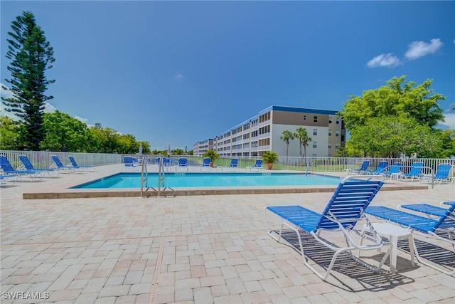14931 Park Lake Dr Unit 209, Fort Myers, FL 33919 - community pool featuring a patio