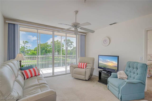 14931 Park Lake Dr Unit 209, Fort Myers, FL 33919 - carpeted living area with ceiling fan and expansive windows