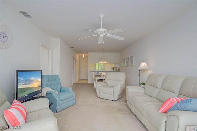 14931 Park Lake Dr Unit 209, Fort Myers, FL 33919 - living room with light carpet and a ceiling fan