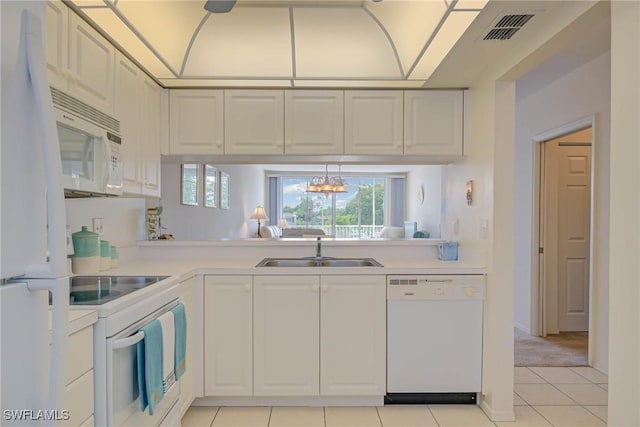 14931 Park Lake Dr Unit 209, Fort Myers, FL 33919 - kitchen with white appliances, a sink, light countertops, light tile patterned floors, and white cabinets