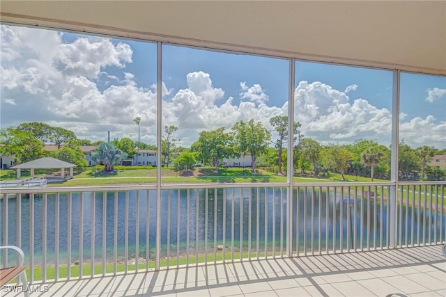 14931 Park Lake Dr Unit 209, Fort Myers, FL 33919 - unfurnished sunroom with a water view