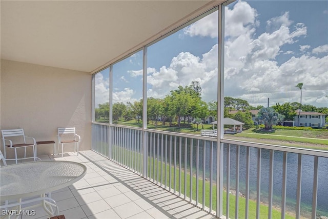 14931 Park Lake Dr Unit 209, Fort Myers, FL 33919 - sunroom / solarium featuring a water view